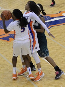 Lady Chargers player Sydney Garnigan (right) blocks an East Georgia State Lady Bobcat so teammate Kayla Carter can dribble around to make a shot. Photo by Taylor Barton
