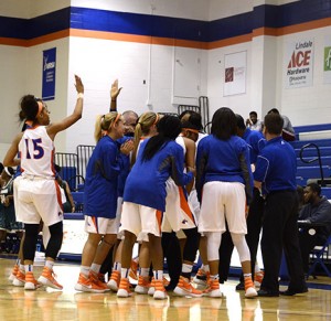 Auriana Broughton high fives with others as the Lady Chargers run away with the game at the end of the third quarter. Photo by Taylor Barton