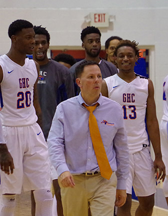 Coach Gaffney (center) leads his team to the court at the mens Region 17 semi-finals. Photo by Taylor Barton