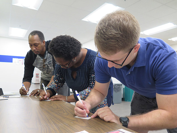 Club members (from left) Justine Dillard, Rodney Dillard and Greyson Oswalt-Smith vote for president in the mock election hosted by the Political Science and Criminal Justice Club at the GHC Floyd Campus. Photo by Luis Martinez