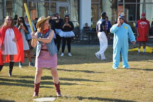 A cowgirl,  baby, variety of superheroes, and other creative costumed individuals gather on the Cartersville campus for a Halloween game of wiffle ball.   Photo by Stephanie Corona 