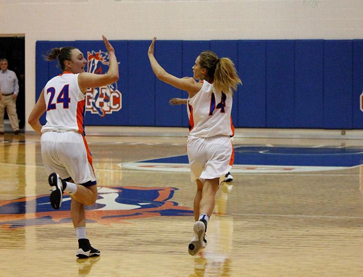 Kateryna Khomenko (24) and Maria Crider high-five during the game on Feb. 22. 