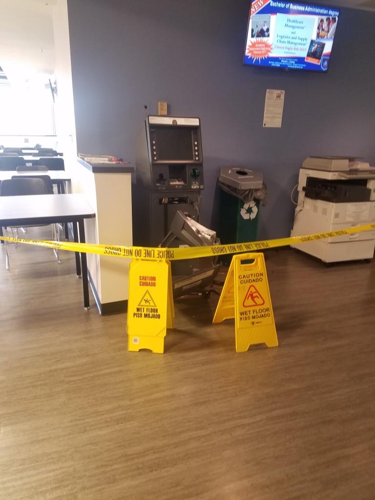 The ATM machine in the Floyd campus Student Center after someone attempted to break-in to it. 
Photo by Kacey Neese