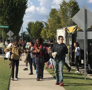 Online students unloading off the bus - Tanique Parker