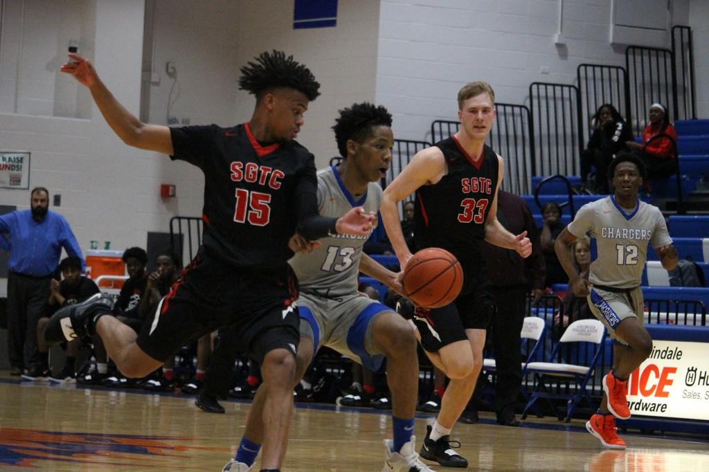 alyl Waters (13) drives in the paint against South Georgia Technical College. Photo by Kayley Agan