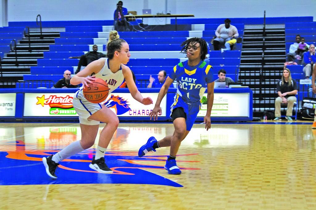 Jessica Eadsforth-Yates dribbles down the court against Southern Crescent Technical College. Photo by Catie Sullivan