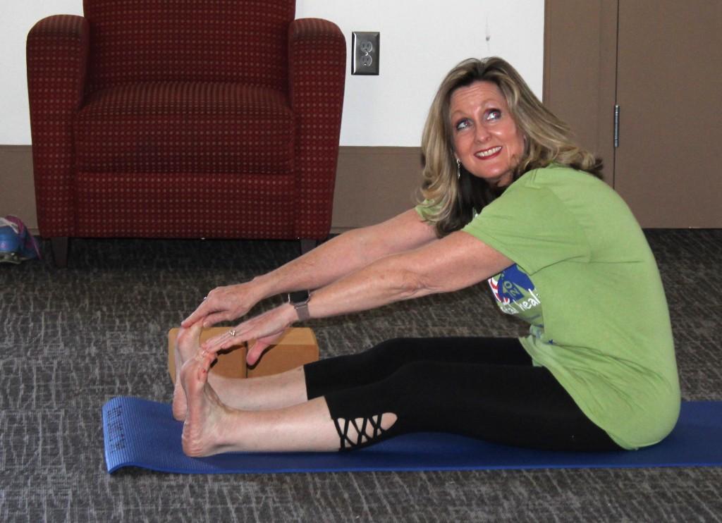 Angie Wheelus, director of Student Support Services, participates in yoga class. Photo by Kayley Agan