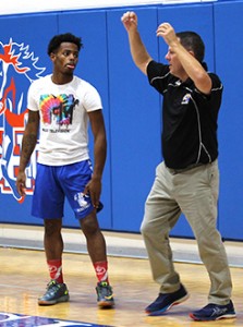 Philip Gaffney, right, talks to Carl Johnson during a practice early in the season. Photo by Lindsay Hamby