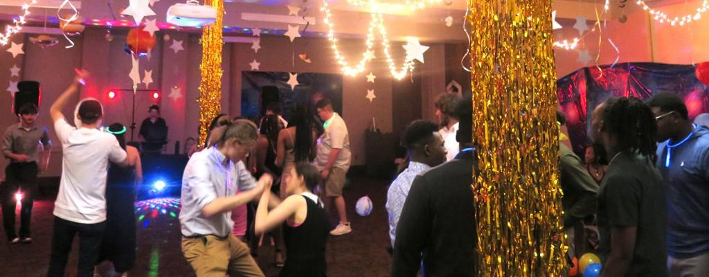 Students dance in a galaxy themed room on the Cartersville campus. Photo by Joseph McDaniel