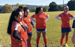 Seven women’s intramural soccer players gather for a game that was ultimately cancelled due to lack of attendance.