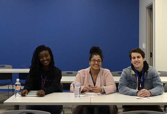 GHC students Nneka Harrison (far left) Akira Dunn (center), and Jackson Benincosa (far right)
attended a poetry session at the writers conference.
Photo by Michelle Hardin