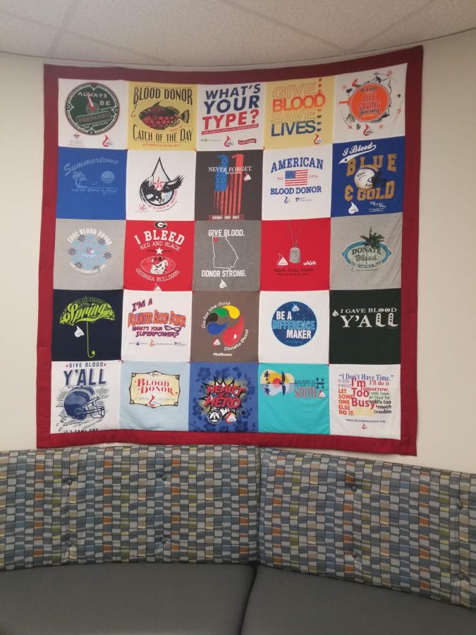 A quilt on the wall at Blood Assurance in Cartersville, made of donor t-shirts.
Photo by David Patel, Senior Staff Writer.
