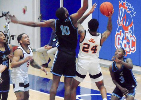Jayvis Harvey (24) tries to put up a shot for the Chargers in their game against Chattahoochee Valley Community College on November 1, 2021.