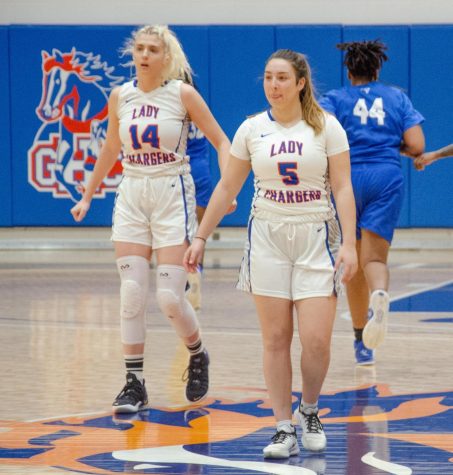 After the Lady Chargers scored a basket, Rita Kun (14) and Naz Oget (5) get ready to play defense in their game against Spartanburg Methodist on March 6, 2021.