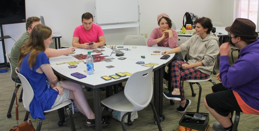 Members of the Gaming Club, including President Tristen Tolbert and Co-Advisor Victoria Banks, gathered in the Paulding campus Learning Commons to play board games and partake in pizza at a for a club event called Game Lounge. Members are taking their turns in Betrayal at House on the Hill.