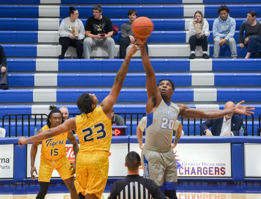 Chargers forward, Ubong Okum (right), and Andrew College forward, Demarco Bethea (left), have a jump ball to start off their game on Jan. 19, 2023.
