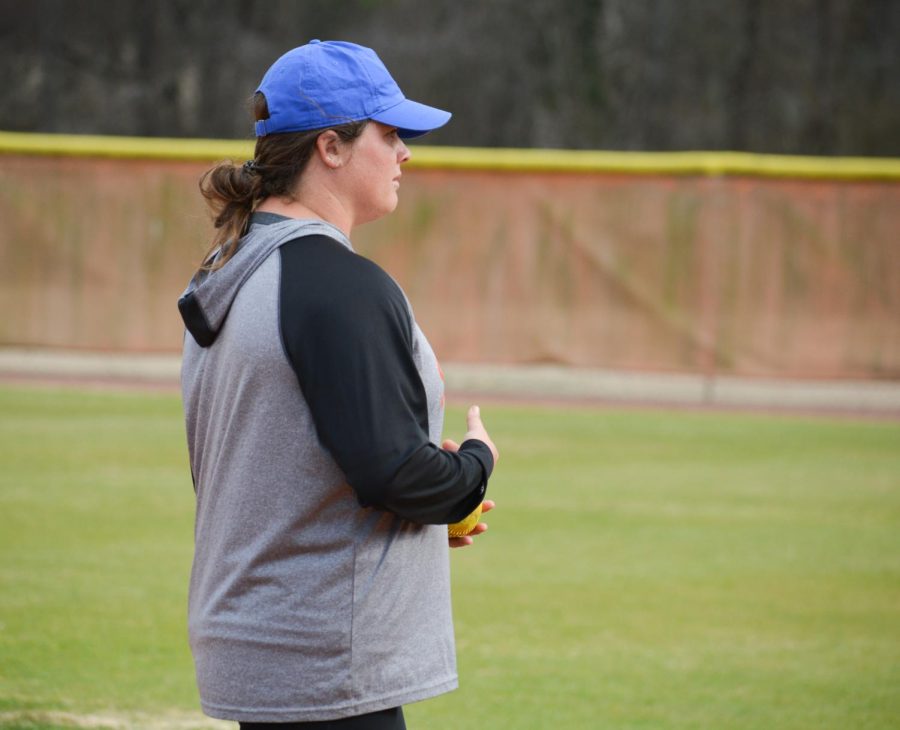 Lady Chargers softball head coach Jordan Thornton looks on as her team goes through drills.