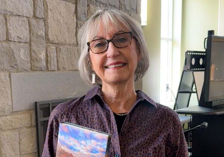Author Sally Bethea is pictured holding her book Keeping the Chattahoochee: Reviving and Defending a Great Southern River.
