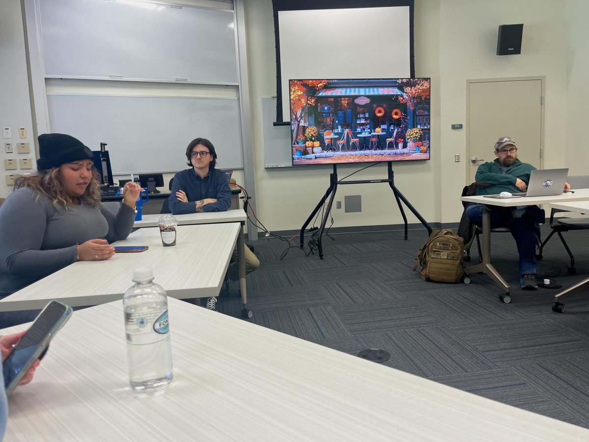 President Mar Diaz (left), Conner Sutton (center) and vice president Brandon Wheeler (right) in a club meeting.