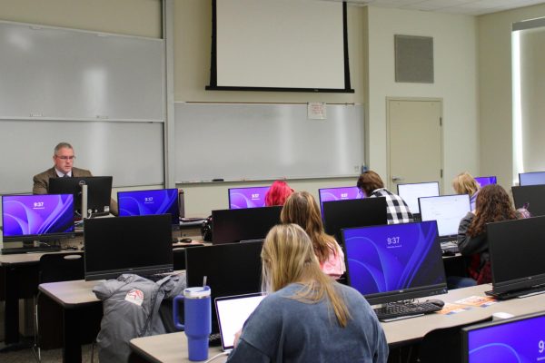 Assistant Professor of English Charles Grimm teaching new British literature class. 