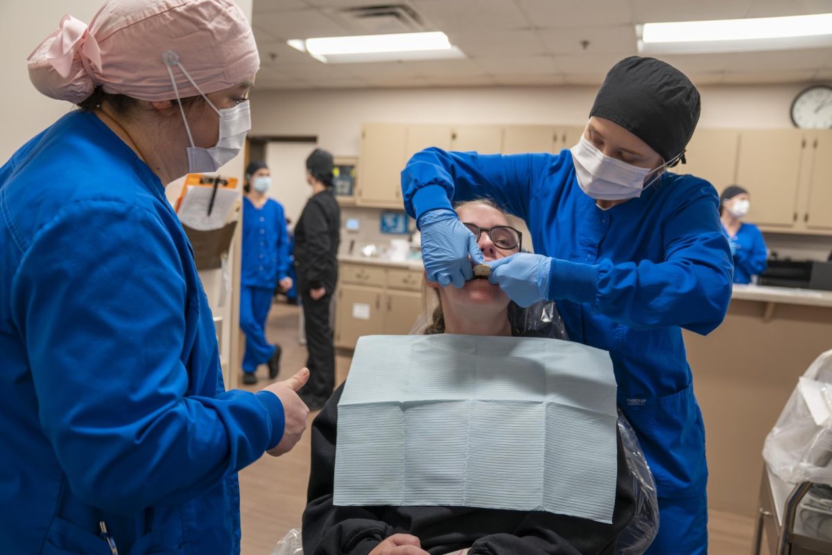 Dental Hygiene students make custom mouthguards for Softball team